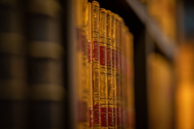 Some old books on a shelf